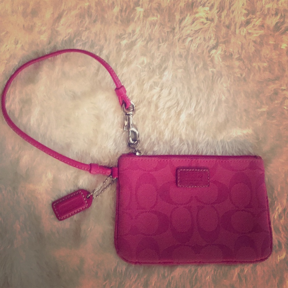 Coach wristlet magenta pink.